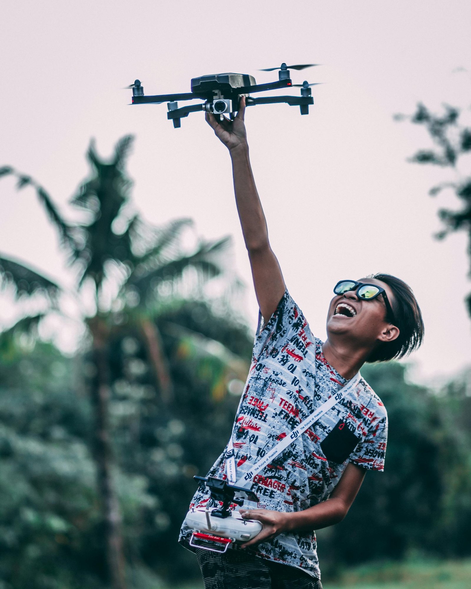 Man Holding Quadcopter Drone With Controller