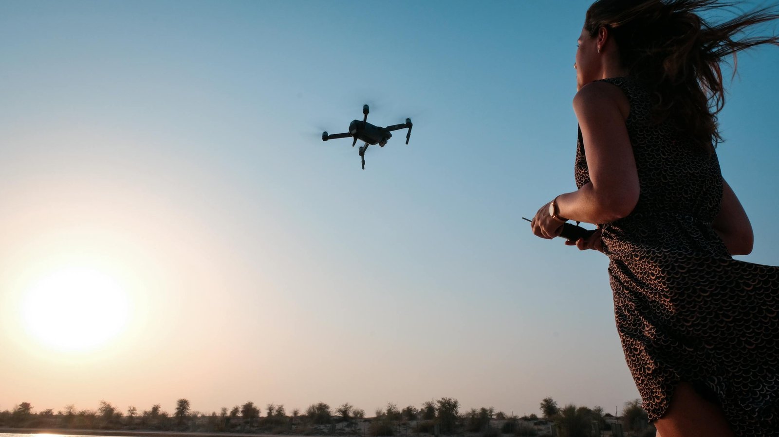 Woman Holding Remote of Drone